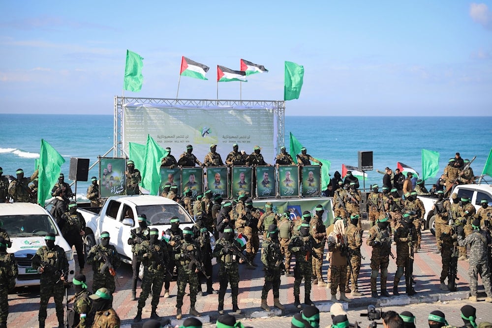 Hamas Resistance fighters deploy at the stage where the hand over of American-Israeli captive Keith Siegel, 65, to the Red Cross will take place in Gaza City, Saturday Feb.1, 2025.(AP)