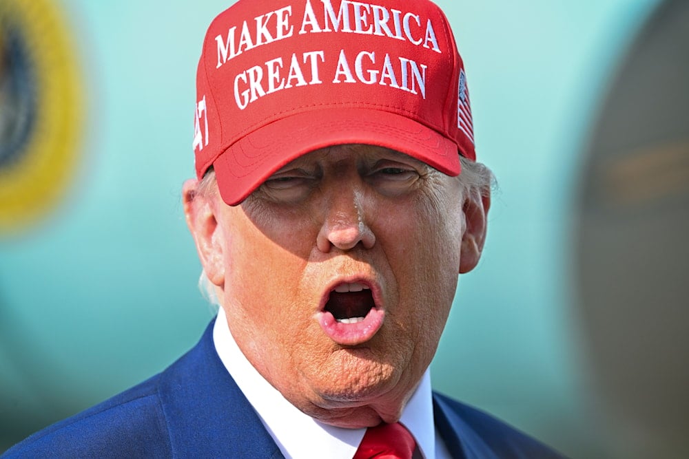 President Donald Trump speaks to reporters after landing at Palm Beach International Airport in West Palm Beach, Fla ., Sunday, Feb. 16, 2025 (AP)