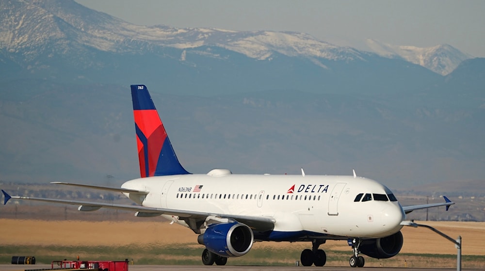 Delta Airlines jetliner taxis down a runway for as it arrives at Denver International Airport Tuesday, Dec. 24, 2024, in Denver (AP) 