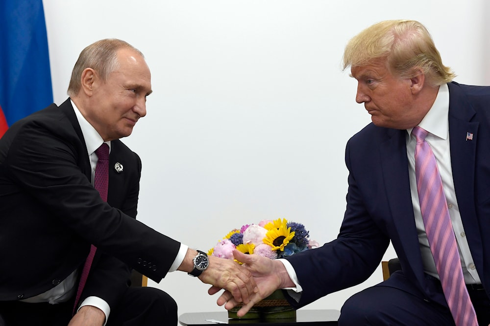 President Donald Trump, right, shakes hands with Russian President Vladimir Putin, left, during a bilateral meeting on the sidelines of the G-20 summit, June 28, 2019 (AP)