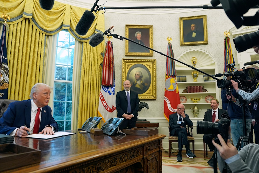 President Donald Trump, from left, speaks while signing an executive order