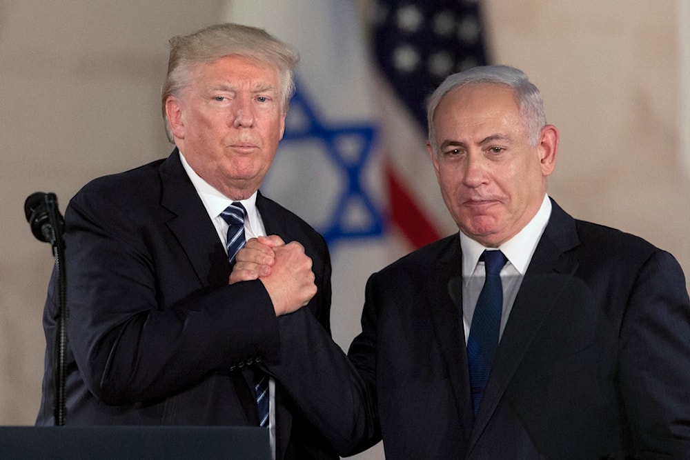 US President Donald Trump and Israeli Prime Minister Benjamin Netanyahu shake hands at The Israel Museum in occupied al-Quds, occupied Palestine, May 23, 2017 (AP)