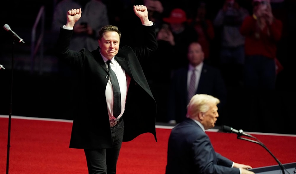 Elon Musk reacts as President-elect Donald Trump speaks at a rally ahead of the 60th Presidential Inauguration, Jan. 19, 2025, in Washington. (AP)