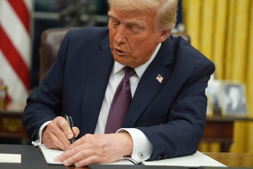 President Donald Trump signs an executive order on birthright citizenship in the Oval Office of the White House in Washington, Jan. 20, 2025 (AP)