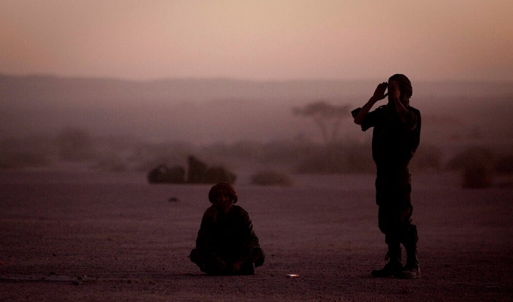 In this Feb.27, 2011 file photo, pro-independence Polisario Front rebel soldiers pray after sunset in the Western Sahara village of Tifariti. (AP)