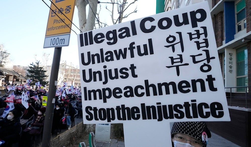 A supporter of impeached South Korean President Yoon Suk Yeol attends a rally to oppose his impeachment near the Constitutional Court in Seoul, South Korea, Thursday, Feb. 20, 2025. (AP)