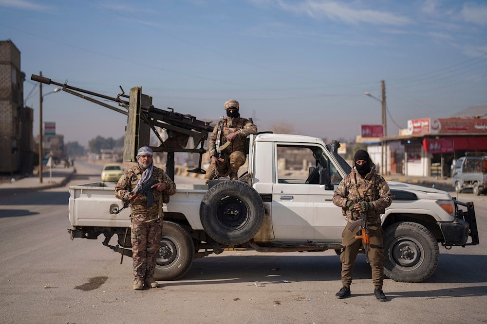 Members of the Syrian Democratic Forces pose for a portrait at a checkpoint in the northeastern city of Hassakeh, on January 31, 2025. (AP)