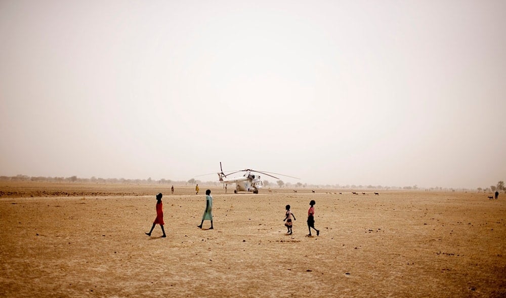 Young children walk across the vast and arid plains near Walgak, South Sudan on Thursday, Feb. 2, 2012. (AP)