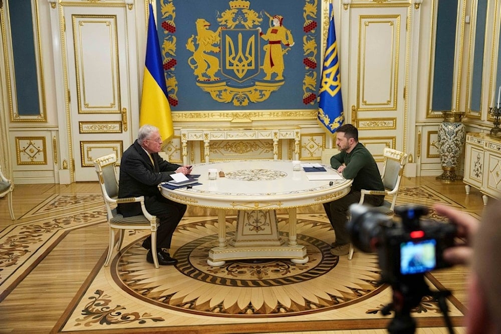 US Special Envoy for Ukraine and Russia Keith Kellogg, left, and Ukraine's President Volodymyr Zelensky talk during their meeting in Kiev, Ukraine, Feb. 20, 2025. (AP Photo/Evgeniy Maloletka)