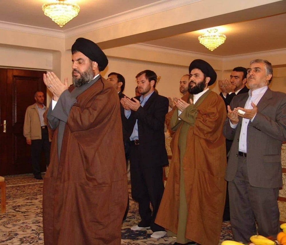 Sayyed Hashem Safieddine prays behind Sayyed Hassan Nasrallah