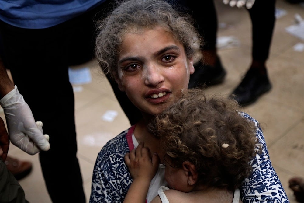 Palestinian children wounded in the Israeli bombardment on a residential building in Bureij refugee camp, are treated at al-Aqsa Martyrs hospital in Deir al-Balah, central Gaza Strip, late Tuesday, June 4, 2024. (AP)