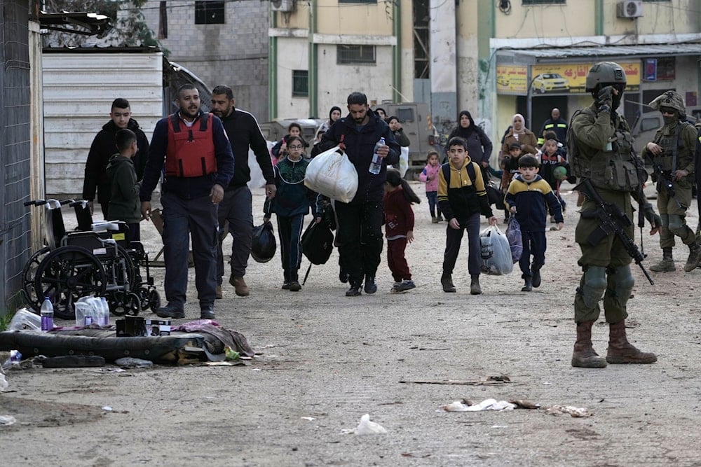 Residents of the West Bank refugee camp of al-Far'a, near Tubas, evacuate their homes as the Israeli military operation continues in the area on Saturday, Feb. 8, 2025. (AP)