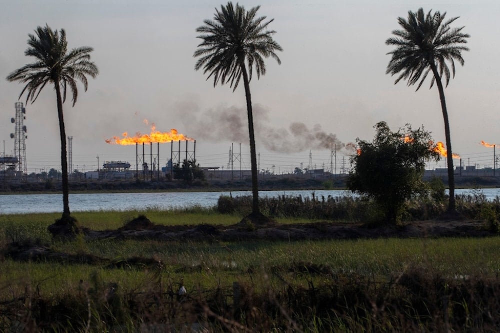 The Nihran Bin Omar oil field flare stacks burn north of Basra, Iraq, Wednesday, March 22, 2023. (AP)