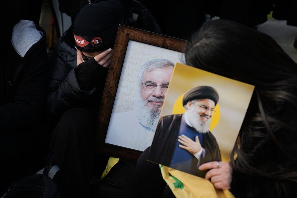 Mourners hold pictures of Hezbollah's former leader Hassan Nasrallah as they gather to attend their funeral procession in Beirut, Lebanon, Sunday Feb. 23, 2025 (AP)