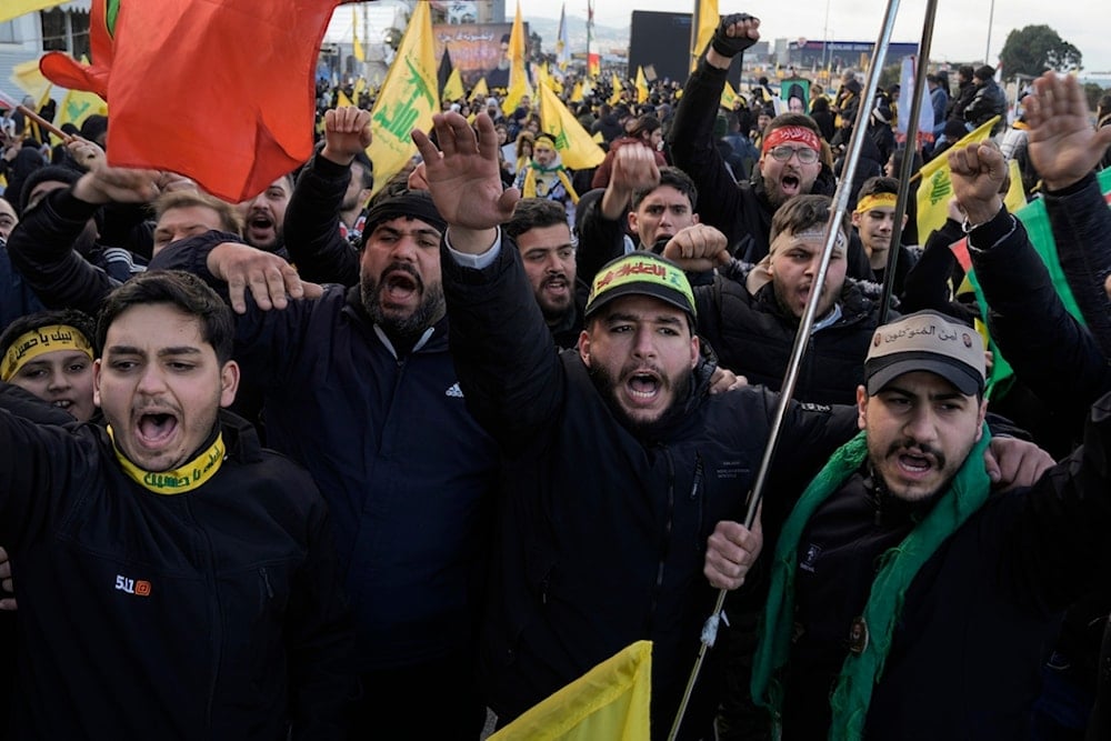 Mourners chant slogans as they gather along a highway for the funeral procession of Lebanon's former Hezbollah leaders, Hassan Nasrallah and Hashem Safieddine, in Beirut, Lebanon, Sunday, Feb. 23, 2025 (AP)