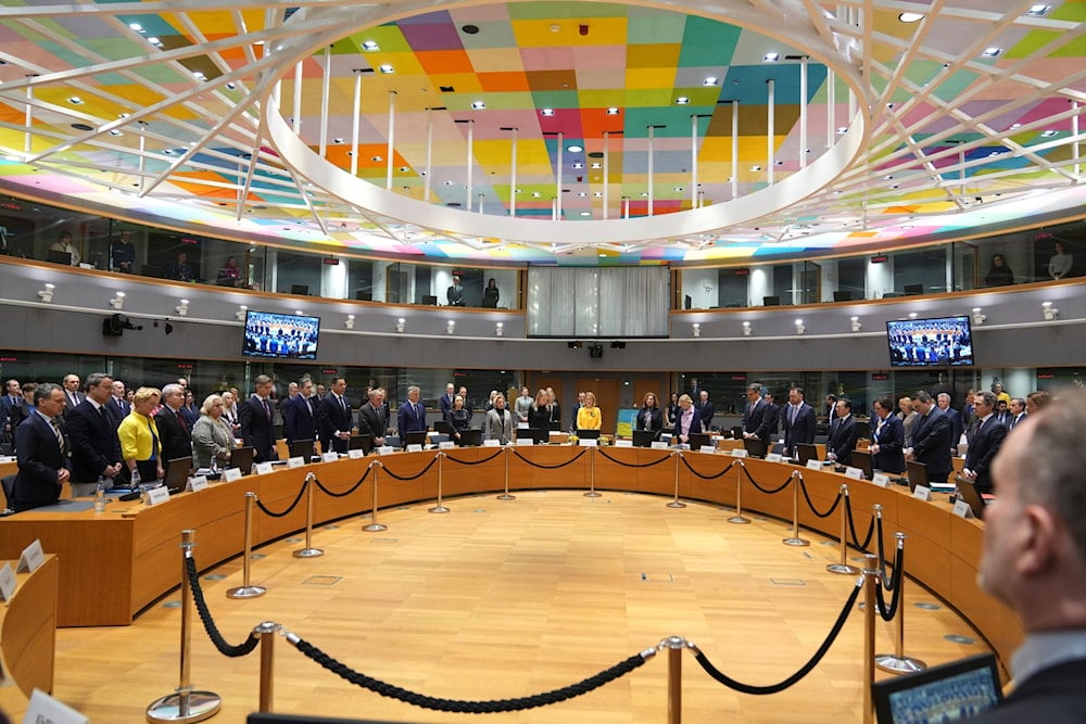 European Union foreign ministers stand for a minute of silence during a meeting of EU foreign ministers at the European Council building in Brussels, Monday, Feb. 24, 2025 (AP)