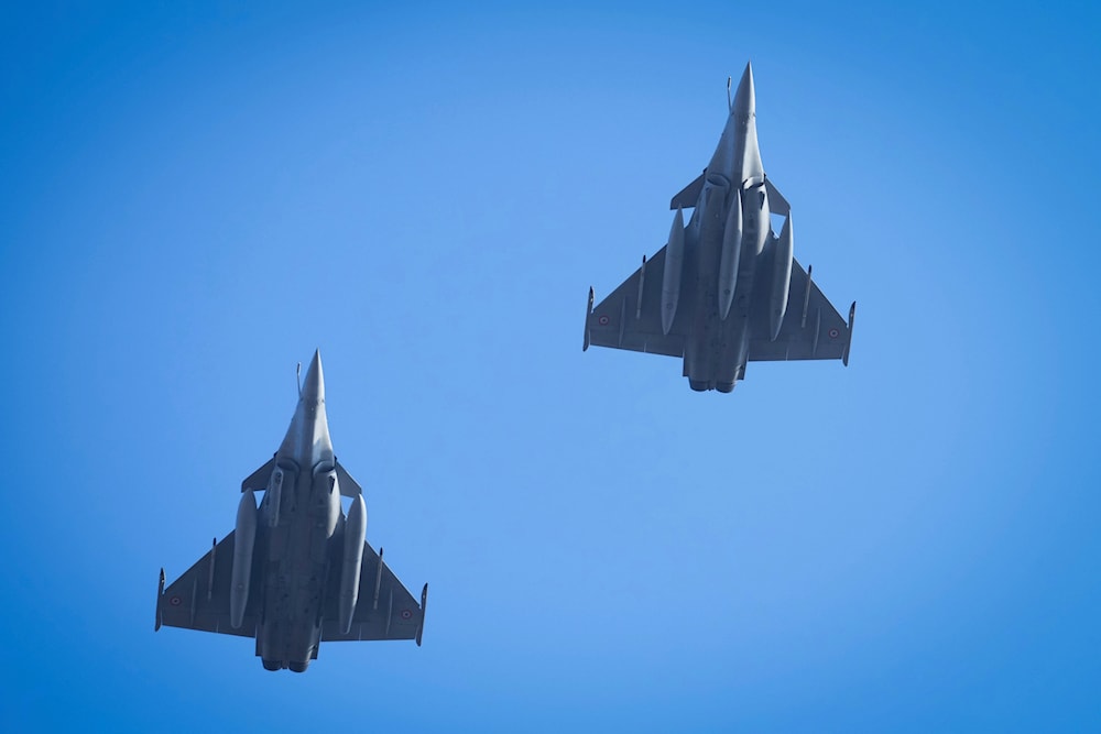 France's Rafale fighter jets fly over the city center during celebrations of the 107th anniversary of the Republic of Estonia, in Tallinn, Estonia, Monday, Feb. 24, 2025. (AP)