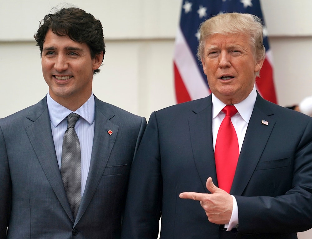 President Donald Trump and Canadian Prime Minister Justin Trudeau pose for a photo as Trudeau arrives at the White House in Washington, on Oct. 11, 2017 (AP)