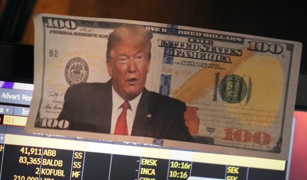 A picture of President Donald Trump on a hundred dollar bill is displayed at a post on the floor of the New York Stock Exchange in New York, Tuesday, Jan. 21, 2025. (AP)