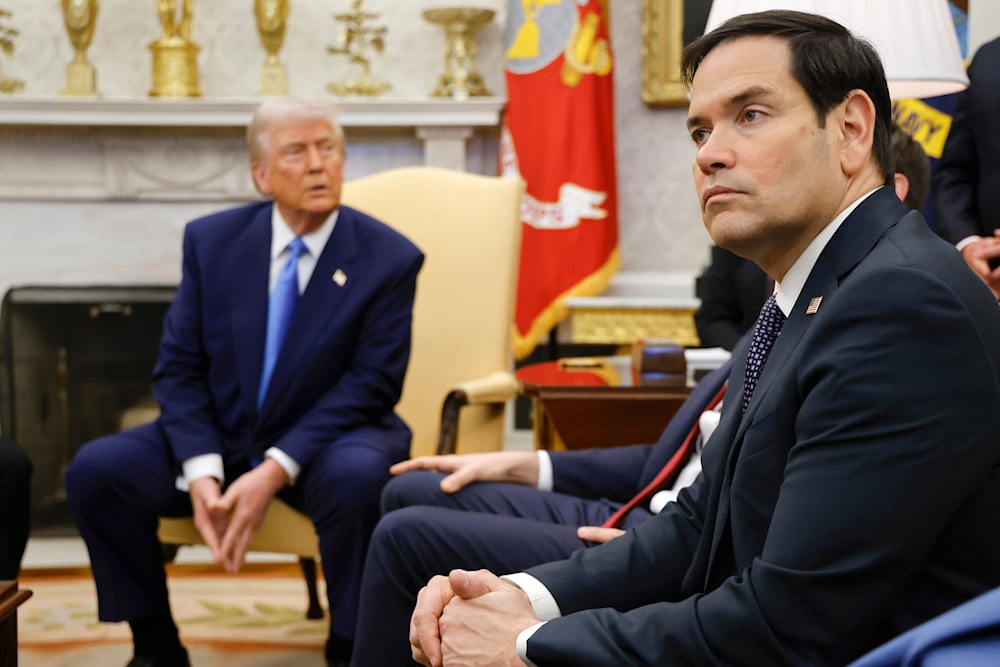 Secretary of State Marco Rubio, right, listens as President Donald Trump, left, meets with France's President Emmanuel Macron in the Oval Office of the White House in Washington, Monday, Feb. 24, 2025 (AP)