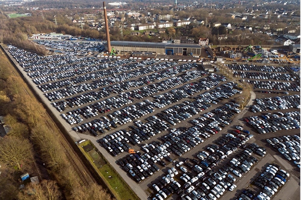 New German cars are stored at a logistic center in Essen, Germany, Monday, Feb. 3, 2025, as US President Trump threatens the European Union (EU) with new tariffs (AP)