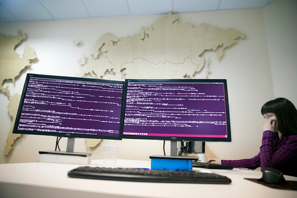 A computer code is seen on displays in the office of Global Cyber Security Company Group-IB in Moscow, Russia, Wednesday, Oct. 25, 2017 (AP)