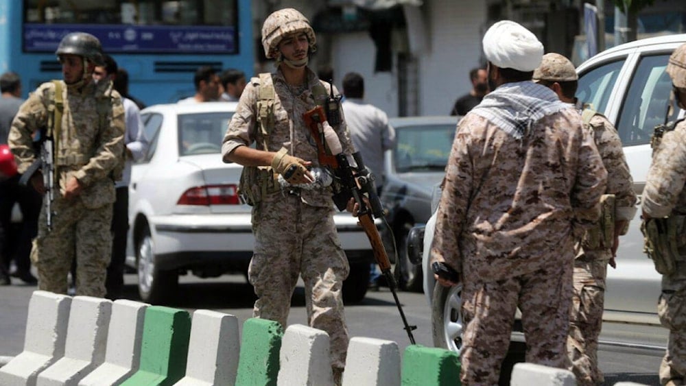 Members of the Iranian Revolutionary Guard secure the area outside the Iranian parliament during an attack on the complex in the capital Tehran on June 7, 2017. (AFP)