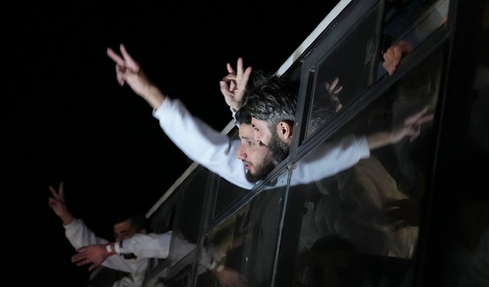 Freed Palestinian prisoners wave from a bus as they arrive in the Gaza Strip after being released from an Israeli prison, in Khan Younis, Gaza Strip, Thursday, Feb. 27, 2025. (AP)