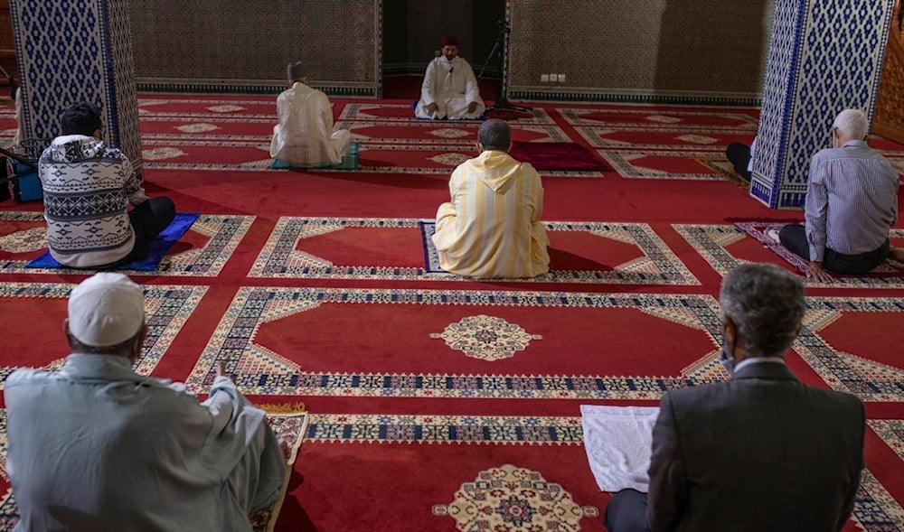 Muslim worshippers observe social distancing inside a mosque during Friday prayers in Rabat, Morocco, Friday, Oct. 16, 2020. (AP)