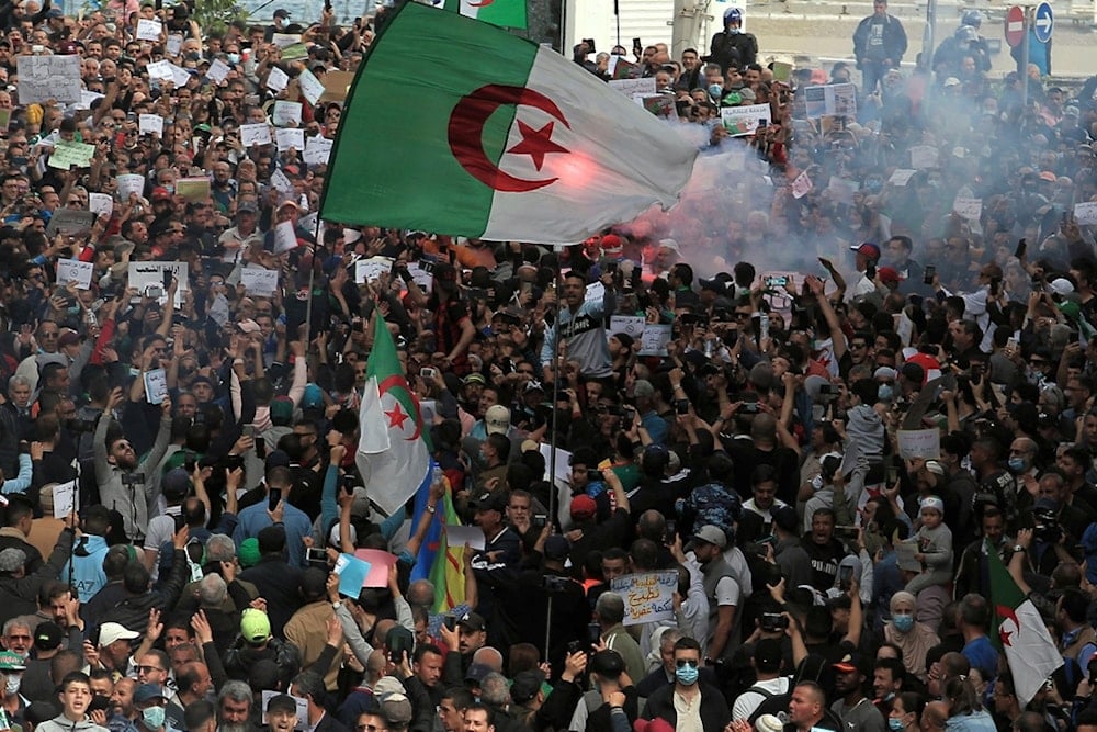 Demonstrators take the street of Algiers, Friday, April 2, 2021 (AP)