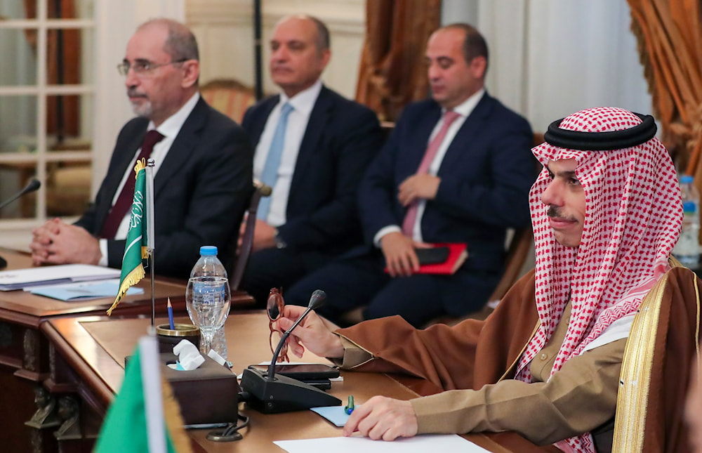 Jordan's foreign minister Ayman Safadi, left,and Saudi foreign minster Faisal bin Farhan attend sa meeting of Arab League foreign ministers in Cairo, Egypt, Saturday, Feb. 1, 2025. (AP)