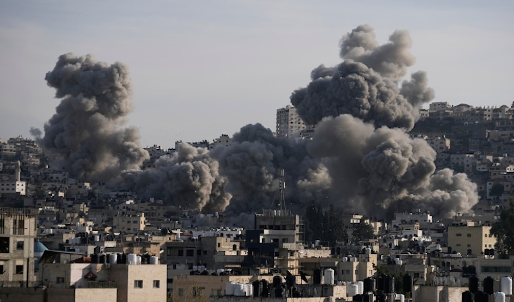 Smoke rises following an explosion detonated by the Israeli occupation forces in the West Bank Jenin refugee camp, Sunday, Feb. 2, 2025. (AP)