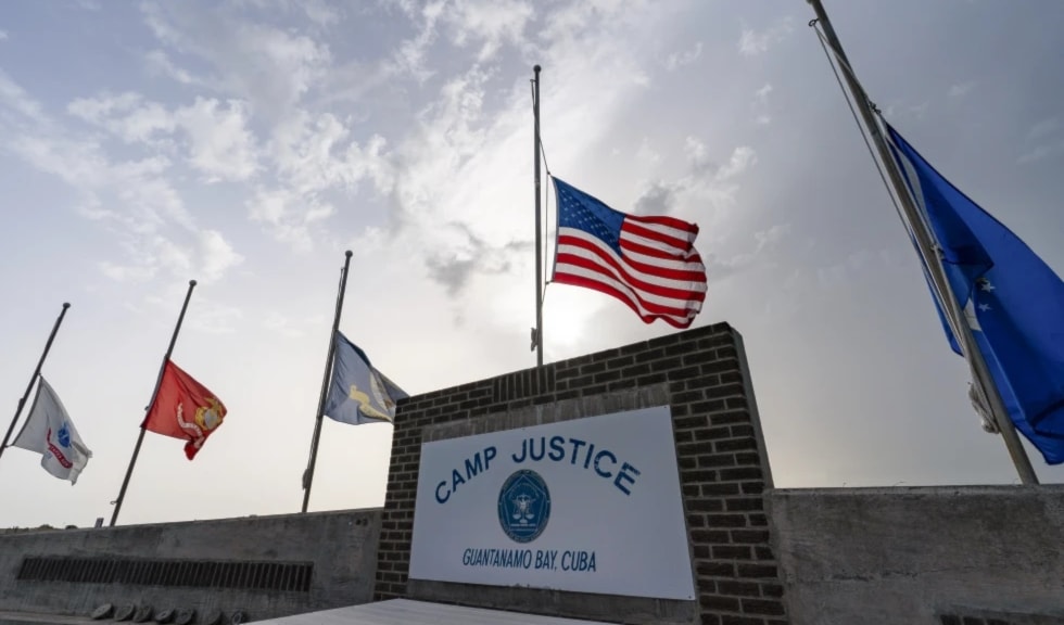 In this photo reviewed by US military officials, flags fly at half-staff at Camp Justice, Aug. 29, 2021, in Guantanamo Bay Naval Base, Cuba. (AP)