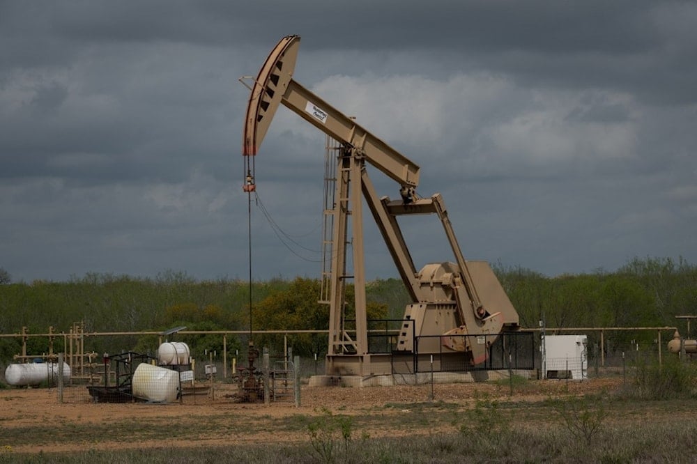 In this file photo taken on March 12, 2019 a pump jack at an oil extraction site is pictured in Cotulla, Texas (Loren ELLIOTT / AFP)