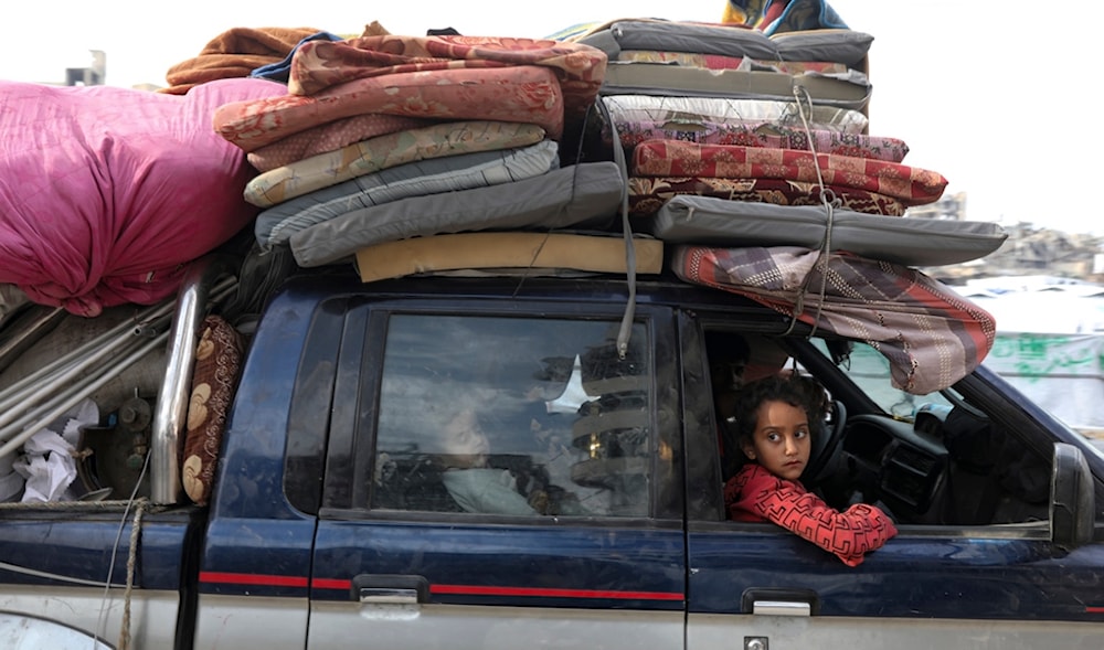 Displaced Palestinians arrive in the northern Gaza Strip, Tuesday, Jan. 28, 2025. (AP)