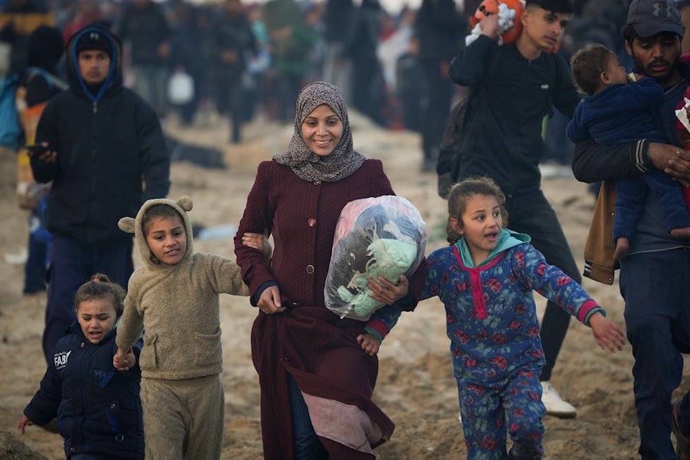 Forcibly displaced Palestinian family return to their homes in the northern Gaza Strip, for the first time since the early weeks of the 15-month Israeli genocide, Monday, Jan. 27, 2025. (AP)