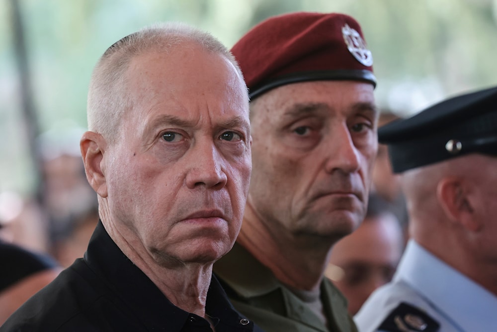 “Israel's” then Security Minister Yoav Gallant, left, and Chief of the General Staff Lieutenant-General Herzi Halevi, attend a ceremony at the Mount Herzl military cemetery in occupied al-Quds, Sunday Oct. 27, 2024. (AP)