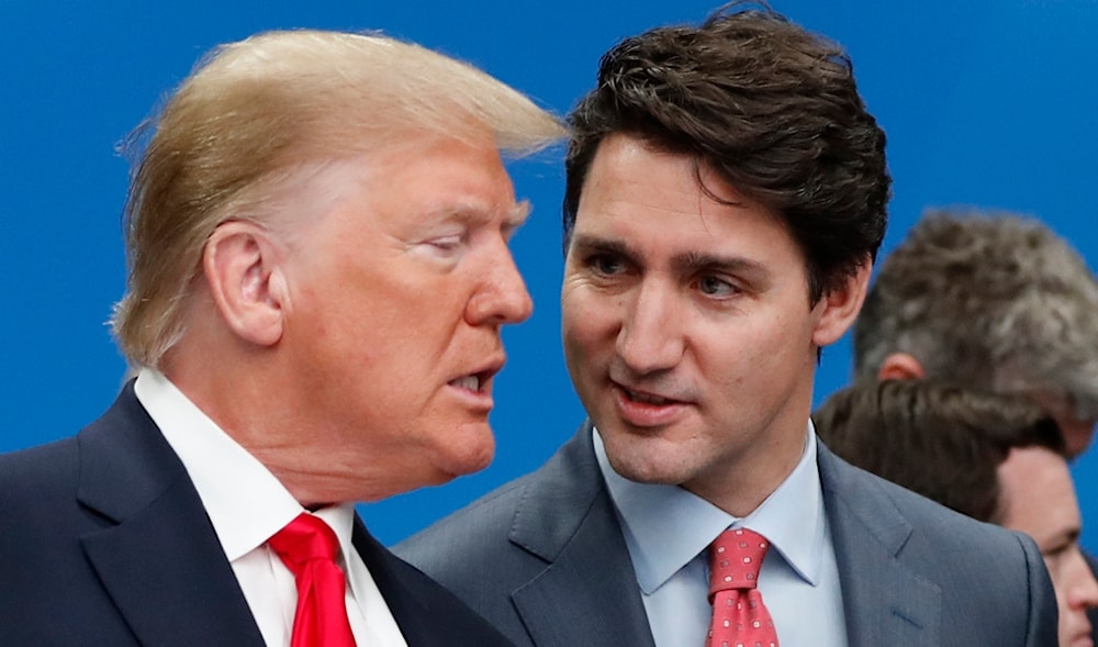 U.S. President Donald Trump, left, and Canadian Prime Minister Justin Trudeau talk prior to a NATO round table meeting at The Grove hotel and resort in Watford, Hertfordshire, England, Dec. 4, 2019. (AP)