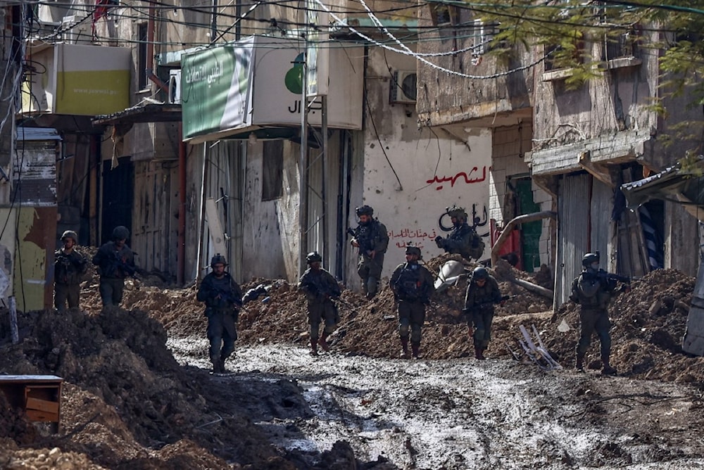 Israeli soldiers deploy at the entrance of the Tulkarm refugee camp near Tulkarm during an ongoing raid on the Palestinian city in the occupied West Bank, on February 5, 2025. (AFP)