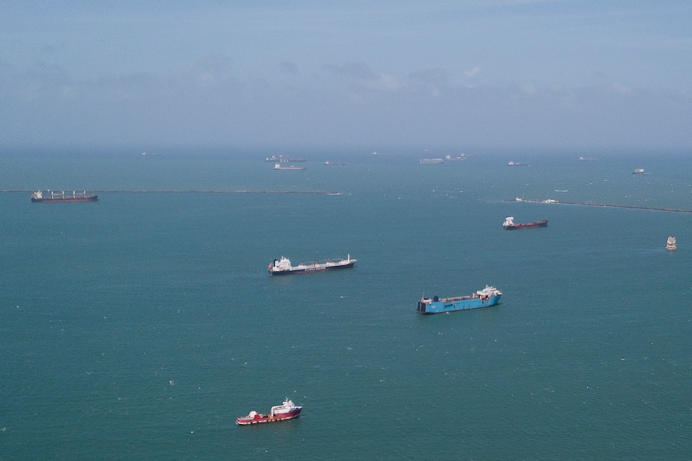 Cargo ships wait to transit the Panama Canal in Colon, Panama, Tuesday, Feb. 4, 2025. (AP Photo/Matias Delacroix)