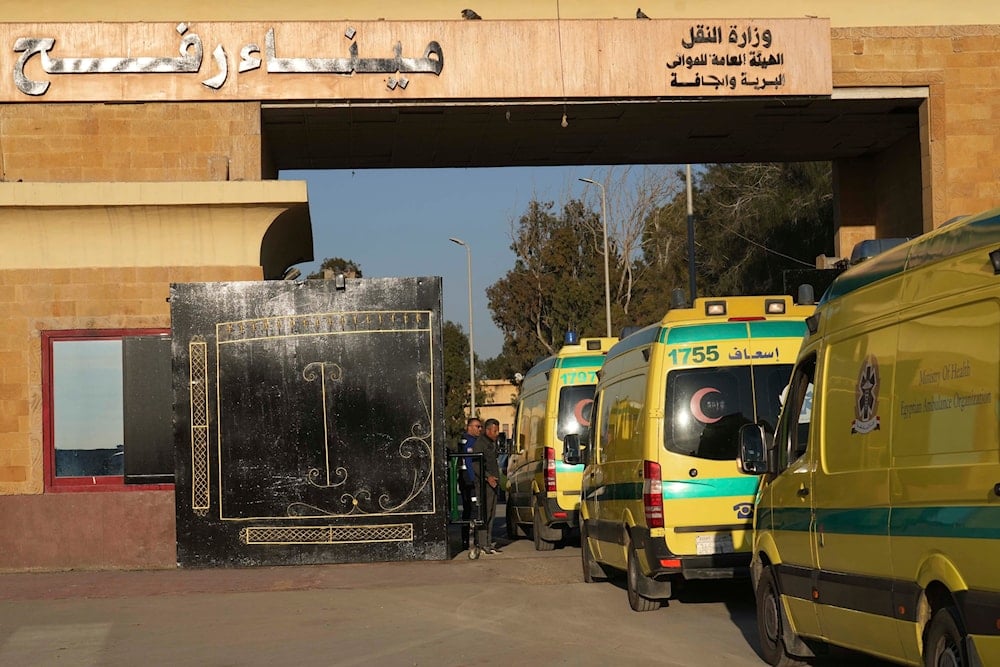 Egyptian ambulances cross the Rafah border crossing in Egypt, Saturday, Feb. 1, 2025. (AP Photo/Amr Nabil)