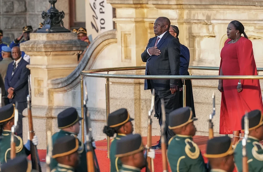 South African President Cyril Ramaphosa gestures for the national anthem from the steps of Cape Town’s city hall before delivering his annual state of the union address, Thursday, February 6, 2025 (AP)