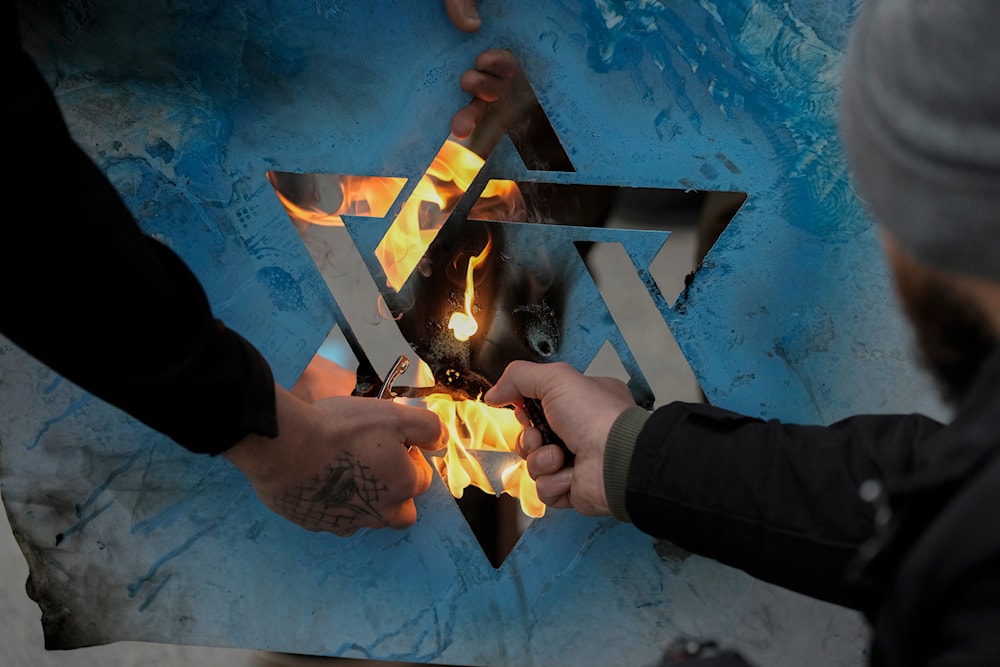 Lebanese people burn an Israeli flag as they protest against statements made by U.S. deputy special envoy for Middle East peace Morgan Ortagus after she met with the country's president, in Beirut, Lebanon, Friday, Feb. 7, 2025. (AP)