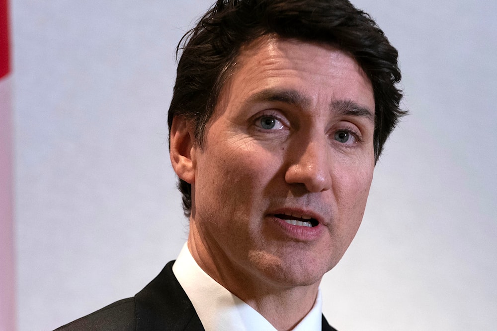 Canada's Prime Minister Justin Trudeau speaks to the media after a meeting with Jay Timmons, president and CEO of The National Association of Manufacturers, in Washington, on January 9, 2025. (AP Photo/Jose Luis Magana)