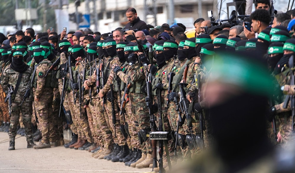 Hamas fighters take up positions ahead of a captive release in Deir al-Balah, central Gaza Strip, Saturday, Feb. 8, 2025. (AP)