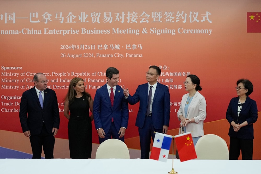 China's Commerce Ministry Foreign Trade Director General, Li Xingqian, third from right, meets with the Panamanian business community in Panama City, Monday, Aug. 26, 2024 (AP)