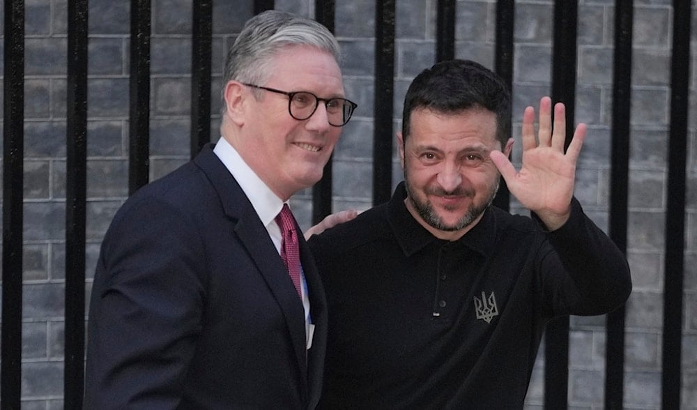 Britain's Prime Minister Keir Starmer, left, greets Ukraine's President Volodymyr Zelensky in Downing Street, London, England, Saturday, March 1, 2025. (AP)