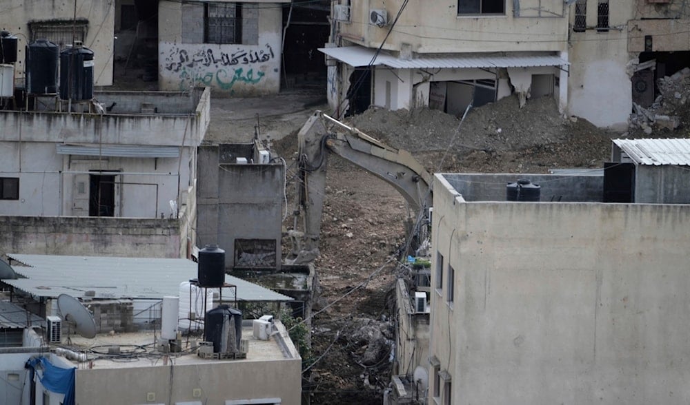 Israeli soldiers demolish a home during a military offensive in the West Bank Nur Shams refugee camp, Saturday, March 1, 2025. (AP)