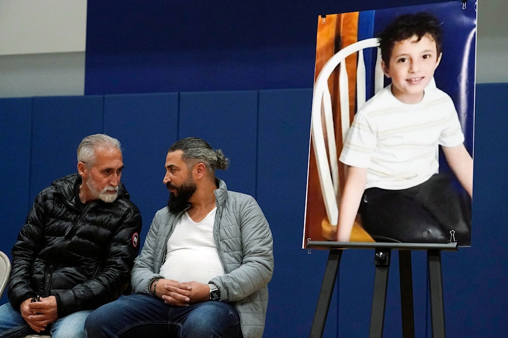 FILE - Wadee Alfayoumi's father, Oday Al Fayoume, seated right, and his uncle Mahmoud Yousef attend a vigil for Wadee at Prairie Activity and Recreation center in Plainfield, Ill., Oct. 17, 2023. (AP)