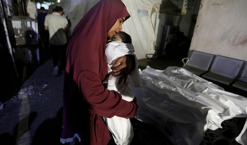 A Palestinian woman mourns her relative, 7-month old baby Hani Qeshta, who was killed in an Israeli bombardment, in Rafah, southern Gaza Strip, Sunday, May 5, 2024. (AP)